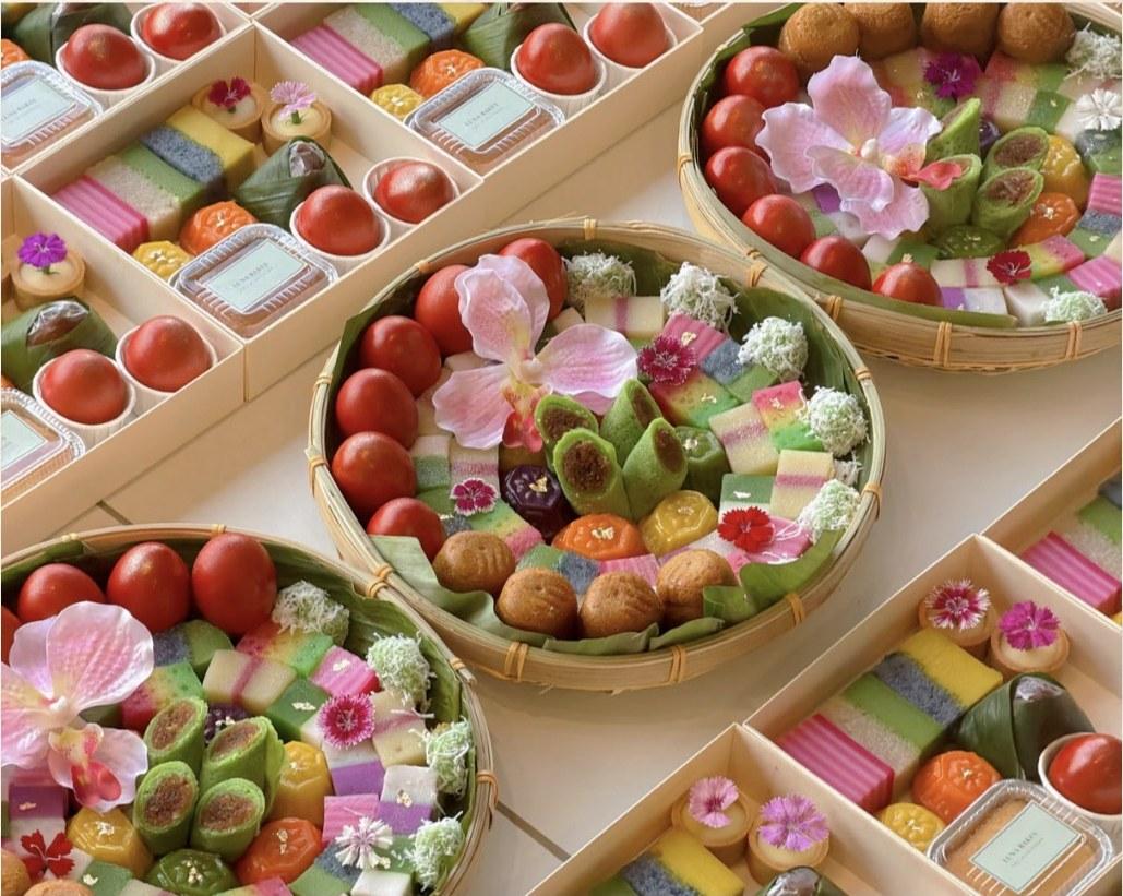 Luna's Kuih Platter, a generous bamboo platter filled with angku kuih, bite size kuih and traditional red eggs for sharing.